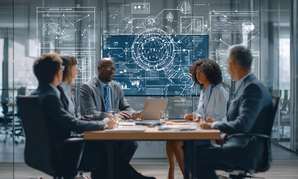 Team che discute in ufficio l'implementazione della norma iso-iec 42001:2023